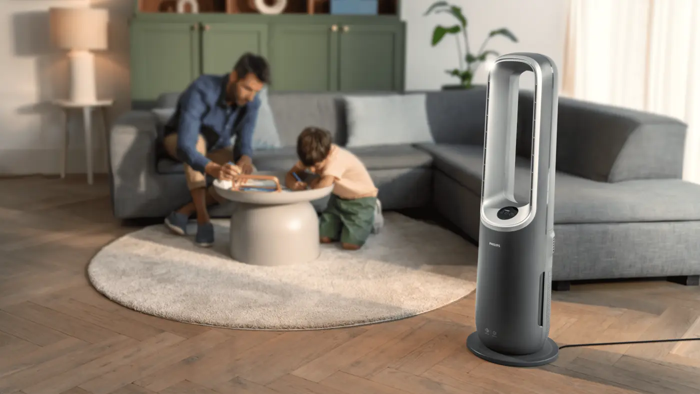 Philips Air Performer 3-in-1 air purifier in a modern living room. Experience superior air quality and stylish design for the ultimate comfort of your family, now. Philips Air Performer 3-in-1 air purifier in a modern living room. Experience superior air quality and stylish design for the ultimate comfort of your family, now.