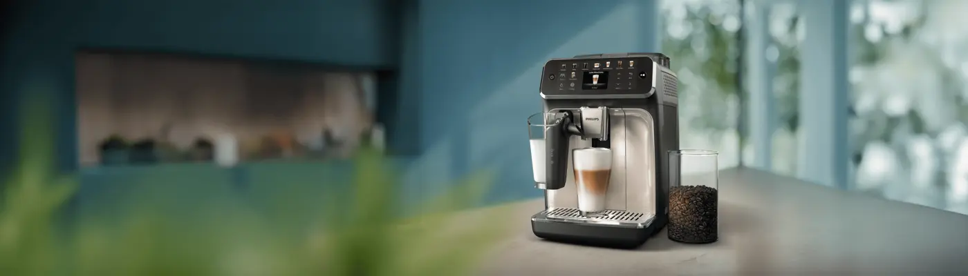 Philips LatteGo 5500 coffee machine dispensing a latte in the modern kitchen Philips LatteGo 5500 coffee machine dispensing a latte in the modern kitchen