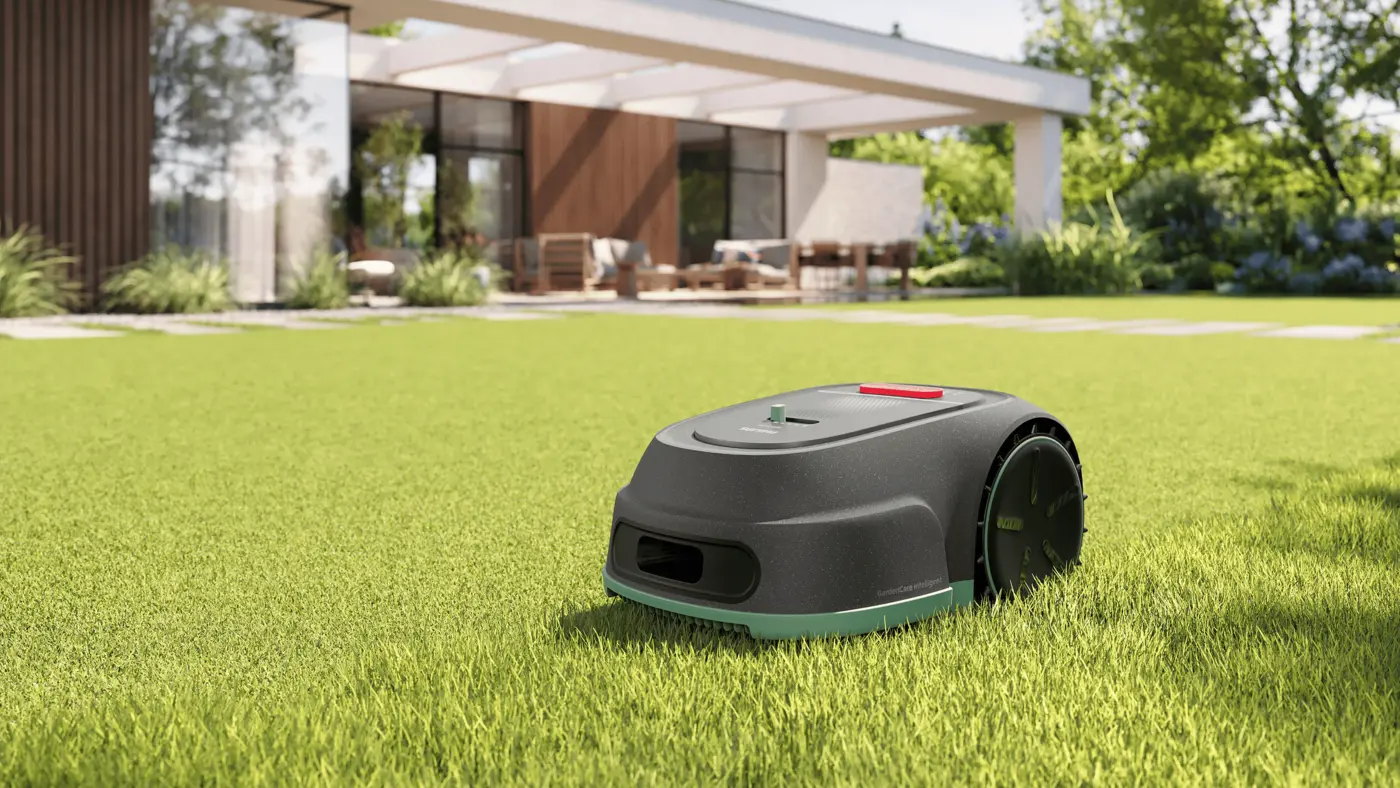 Tondeuse automatique Philips coupant l'herbe dans un jardin moderne avec une terrasse connectée en arrière-plan – tondeuse robotisée intelligente pour un entretien sans effort de la pelouse. Tondeuse automatique Philips coupant l'herbe dans un jardin moderne avec une terrasse connectée en arrière-plan – tondeuse robotisée intelligente pour un entretien sans effort de la pelouse.