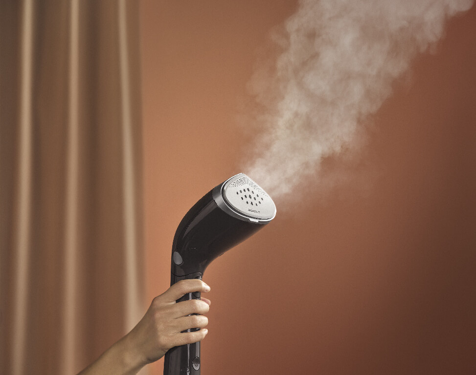 Philips steamer on a brown background Philips steamer on a brown background