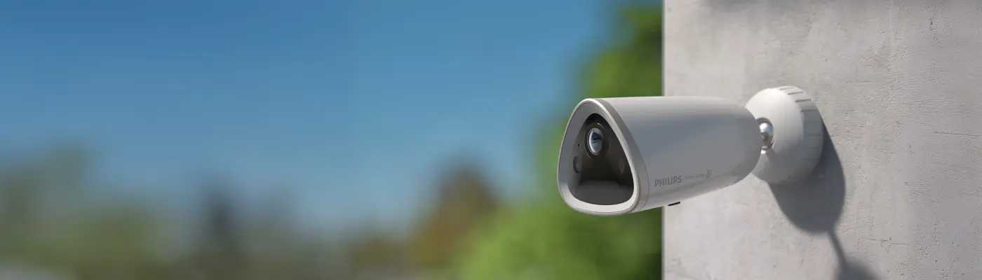 Philips outdoor security camera mounted on a wall, providing reliable home safety Philips outdoor security camera mounted on a wall, providing reliable home safety