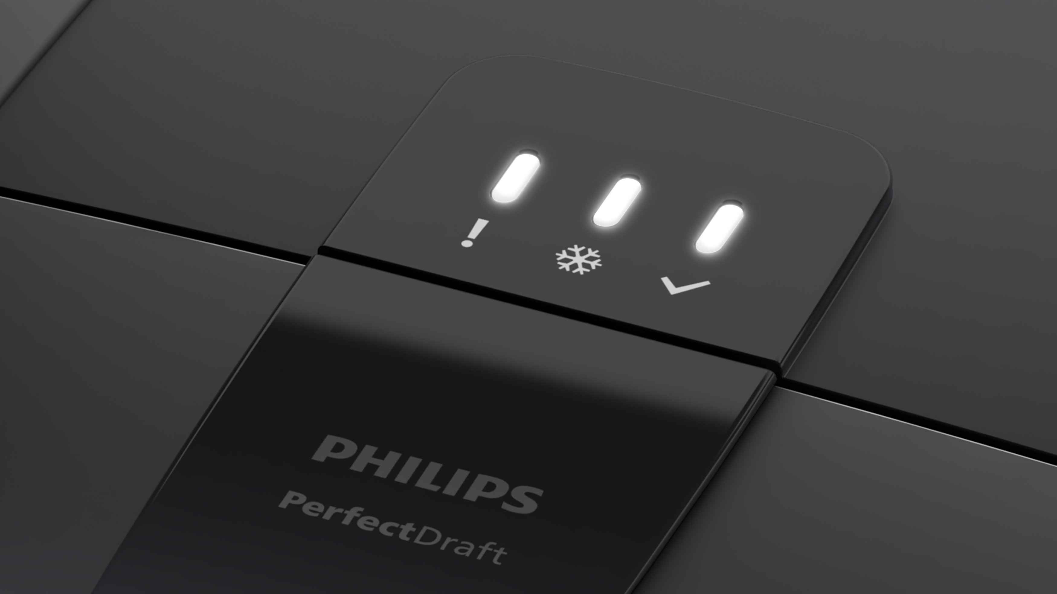 Nærbilde av en elegant svart Philips Perfect Draft øldispenser, som viser opplyste indikatorer: Utropstegn, Snøfnugg for kjøling og et Hake-symbol for klar. Nærbilde av en elegant svart Philips Perfect Draft øldispenser, som viser opplyste indikatorer: Utropstegn, Snøfnugg for kjøling og et Hake-symbol for klar.