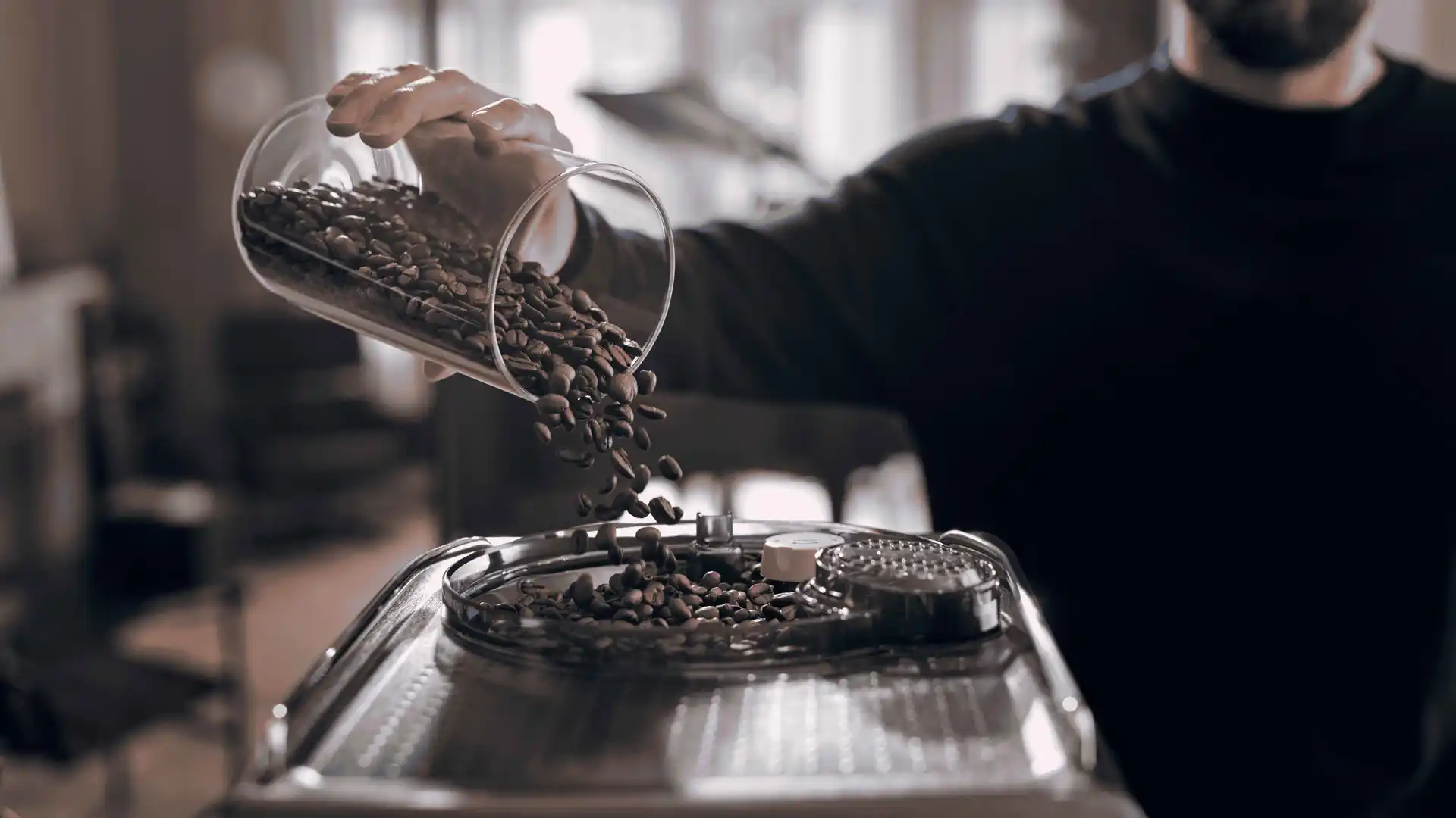 Person pours coffee beans into a Philips Saeco coffee machine hopper. The image highlights Saeco's quality, freshness, and brewing experience. Person pours coffee beans into a Philips Saeco coffee machine hopper. The image highlights Saeco's quality, freshness, and brewing experience.